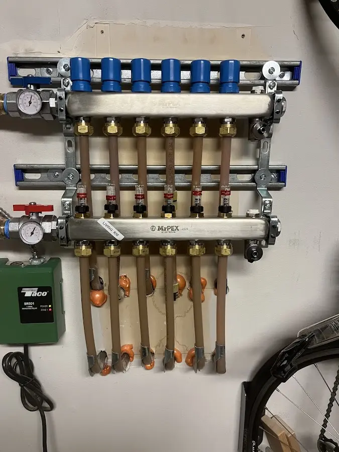 Plumber performing Water Heater Repair at a residential property in Canaan